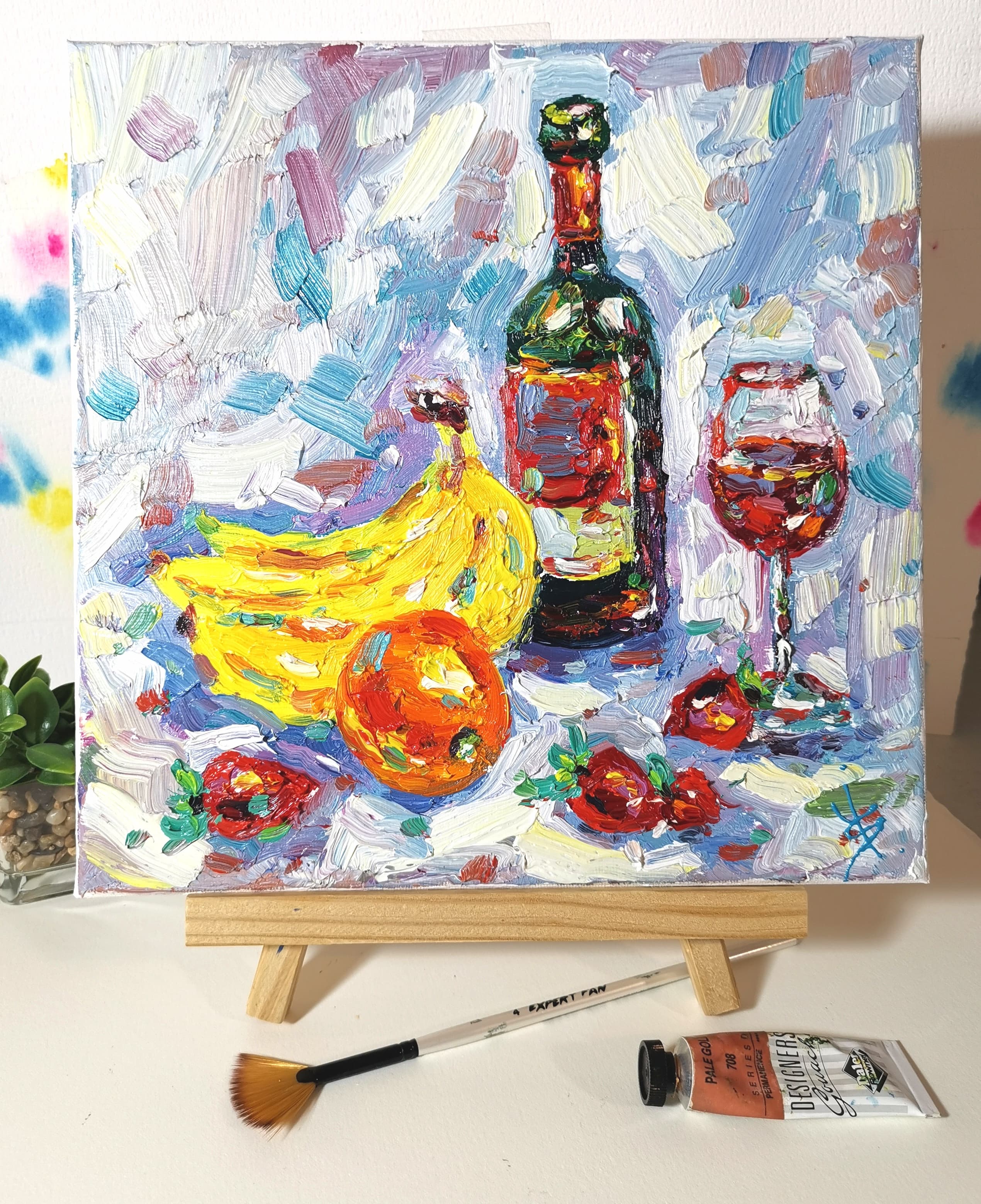 original oil painting still life with wine bottle, glass of red wine, bananas, orange, and strawberries – impasto art on canvas 10x10 inches
